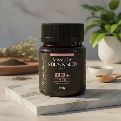 Nature's Blends Black Seed Manuka Honey 83+ MGO 250g botanical scene – UK