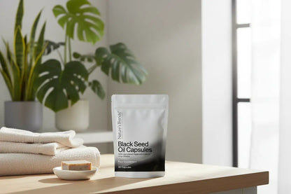 Black seed oil capsules UK wellness — Nature's Blends pouch with plants and towels