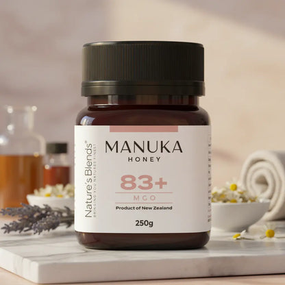 Nature's Blends Manuka Honey 83+ MGO 250g jar botanical flowers scene – UK